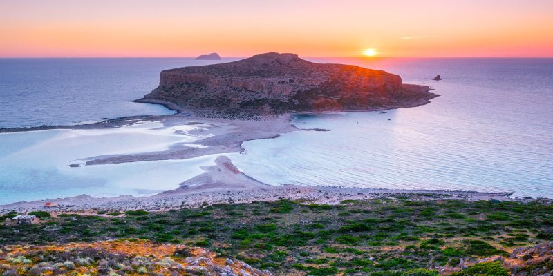 Island Gramvousa and the beautiful Balos beach on sunset in Crete island, Greece. Horizontal camera pan