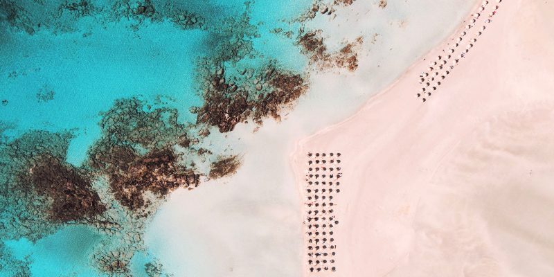 An aerial view of a sandy beach on Crete Island, Greece